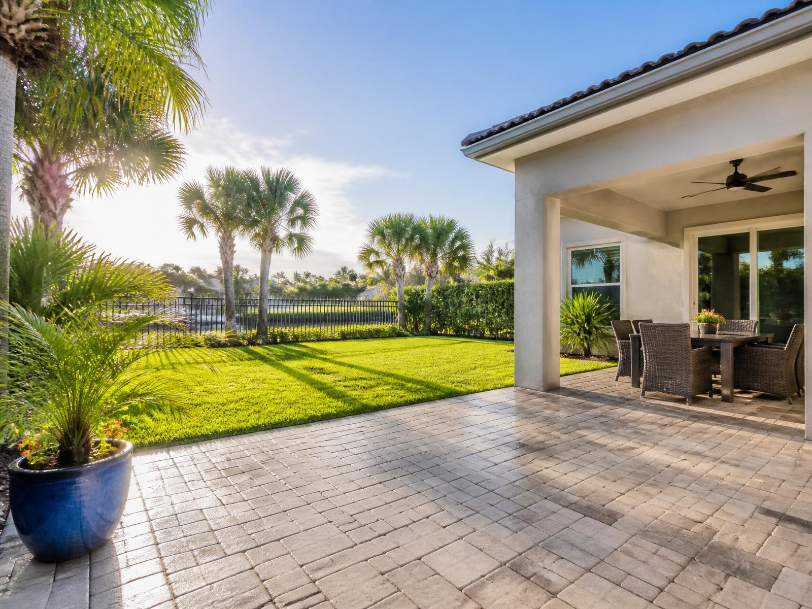 Freshly cleaned Florida patio and driveway outside a residential home